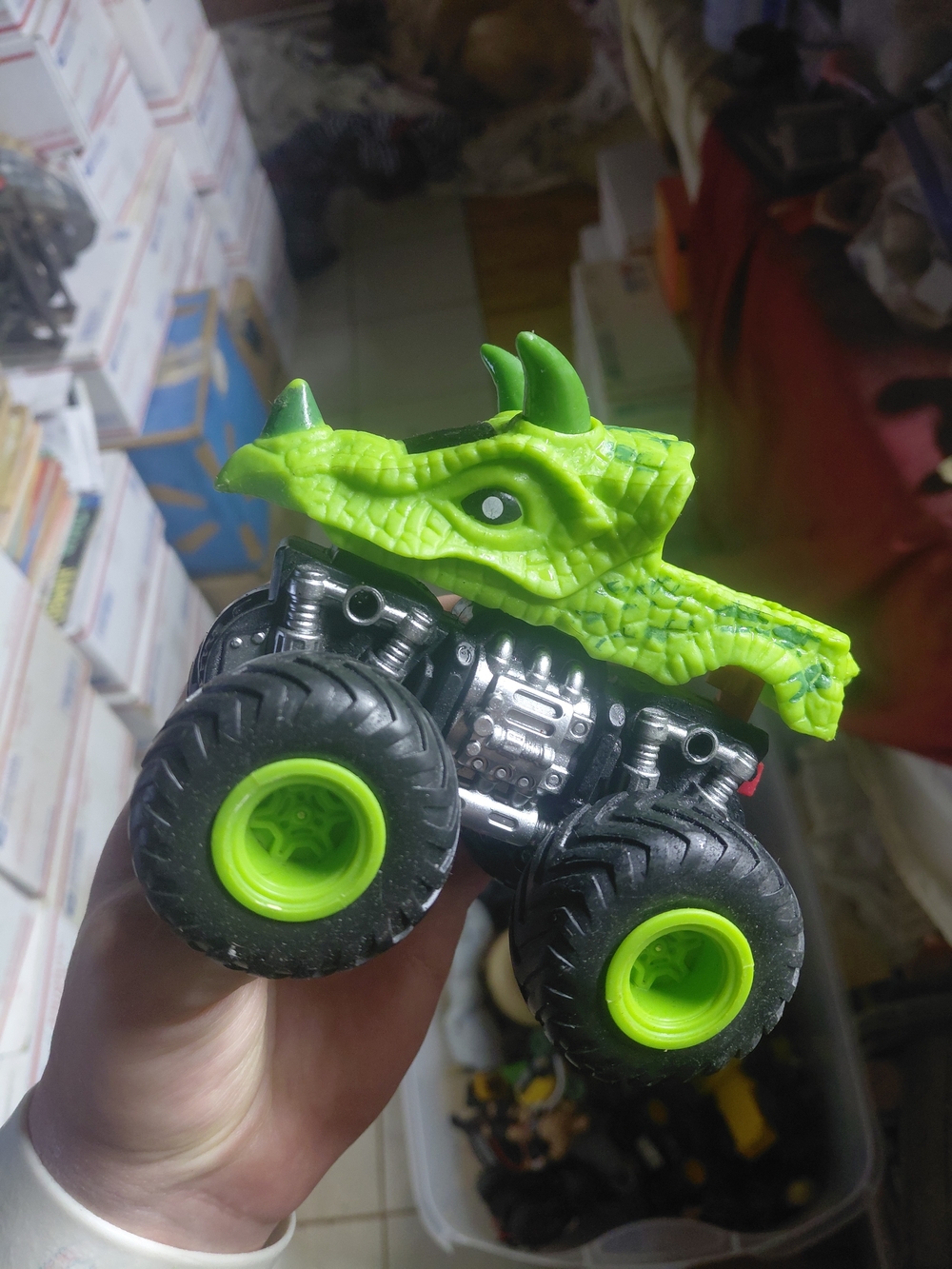a Kid Connection Green Dinosaur Monster Truck - triceratops head front 1:48